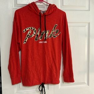 Pink thin drawstring hoodie. Fits more like a medium